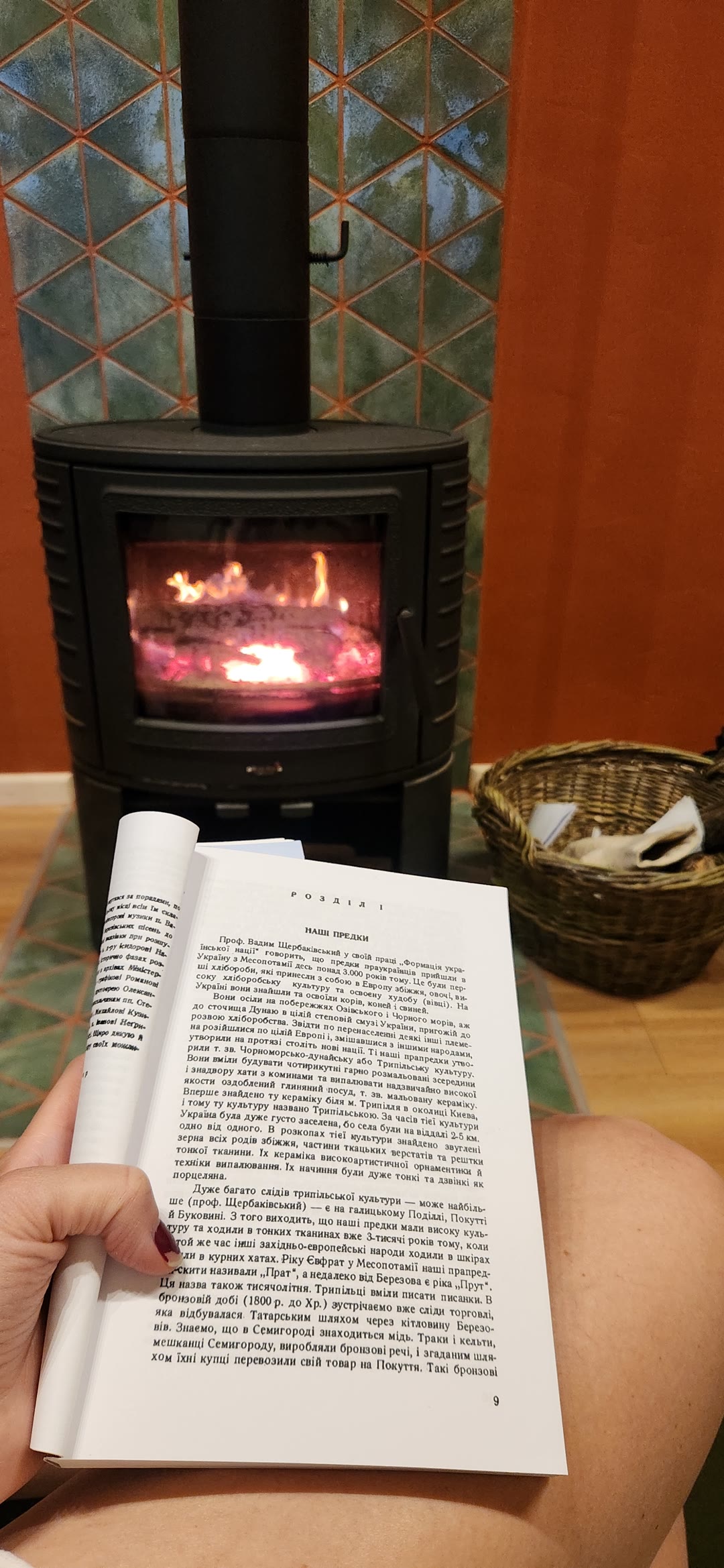 An open book in front of the fire
